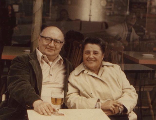 Photo of Harold (with a glass of beer?) and Esther on a restaurant patio, smiling